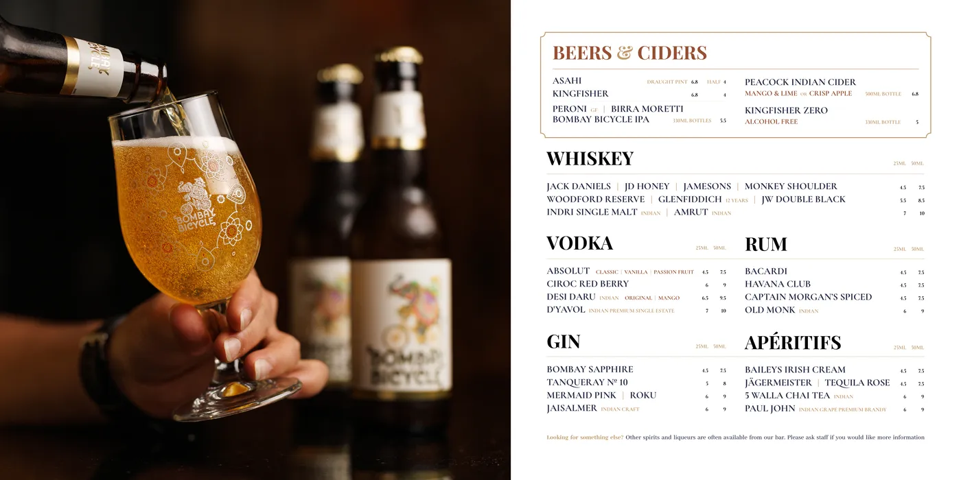 Drinks menu spread: a beer being poured opposite the beers, ciders, whiskey, vodka, rum, gin and aperitifs