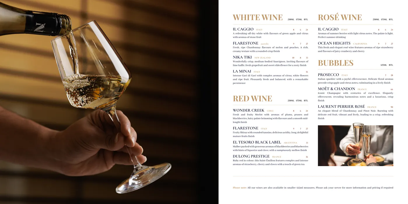 Drinks menu spread: white wine being poured opposite the white, rose, red and sparkling wine lists
